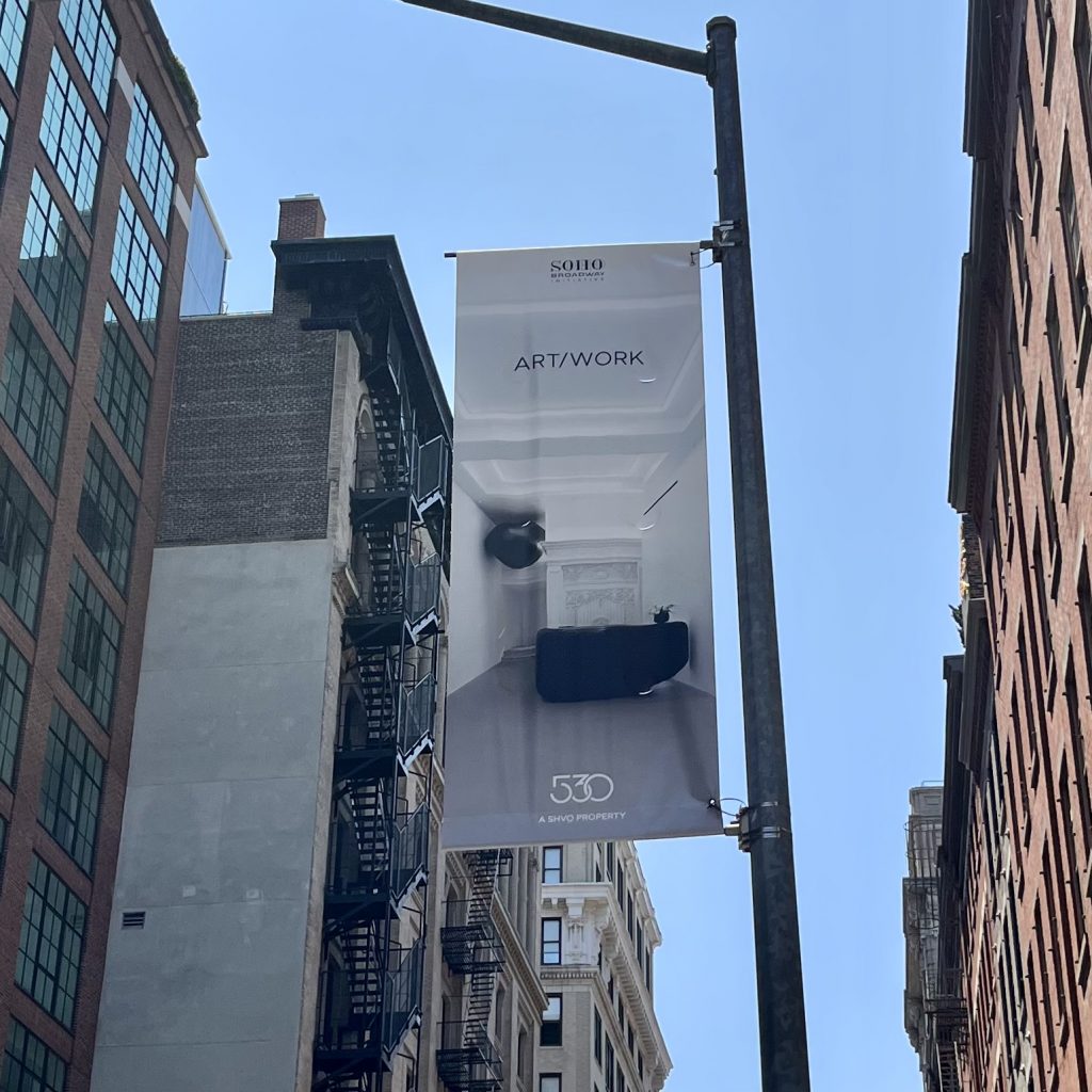 streetlight banner depicting 530 Broadway lobby